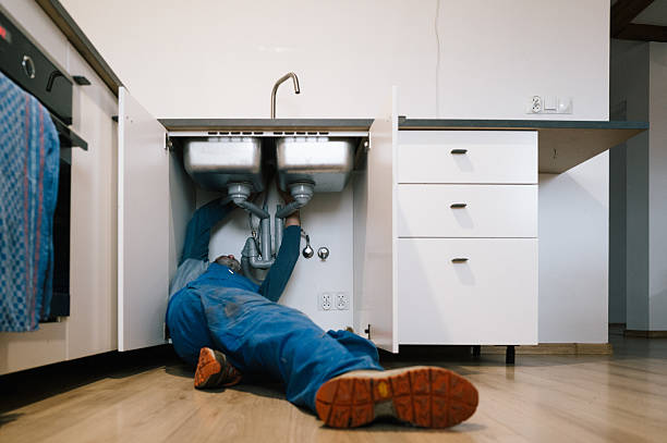 Professional Emergency Plumber technician working in Essig, MN
